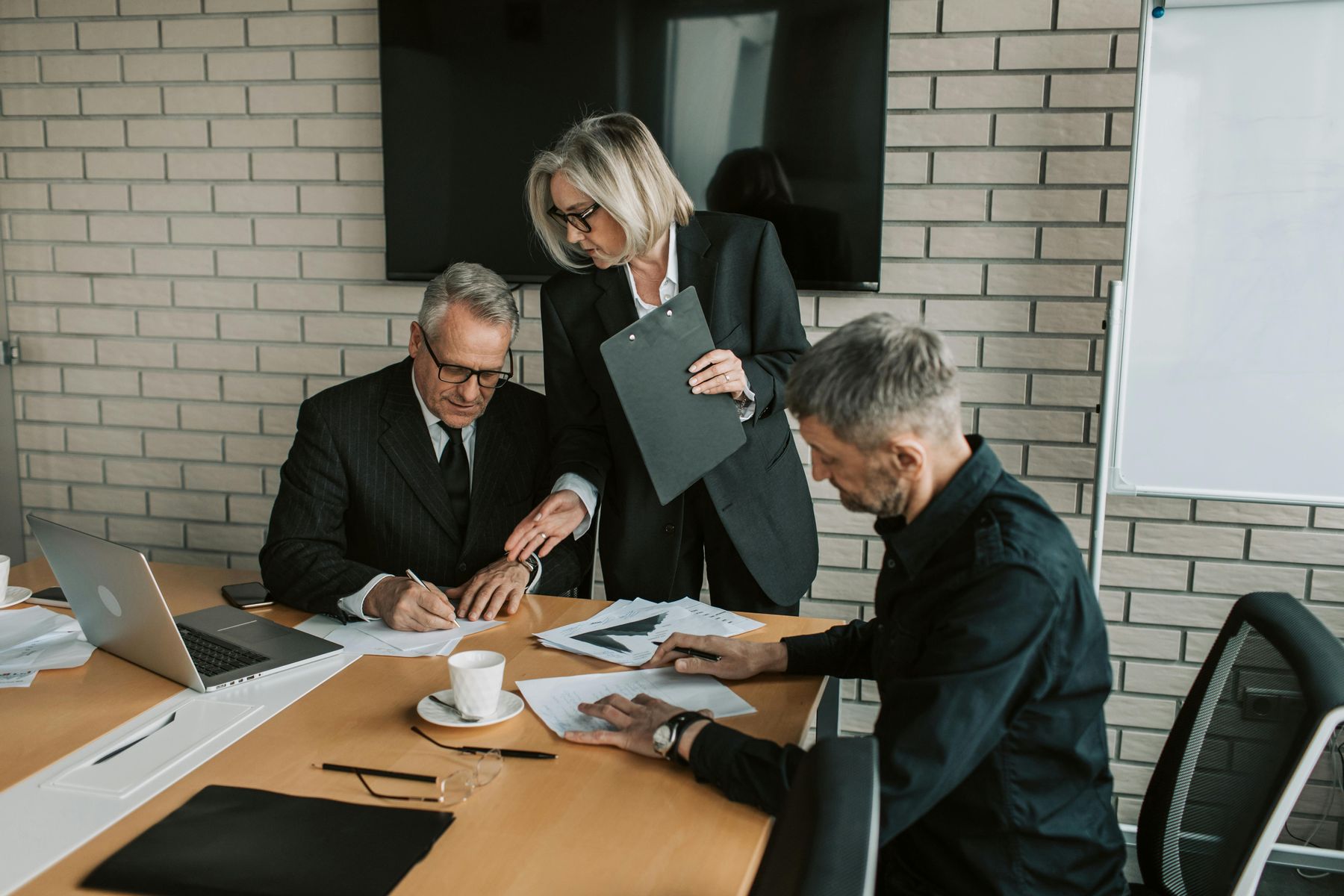 apHarmony team reviewing a project at a desk